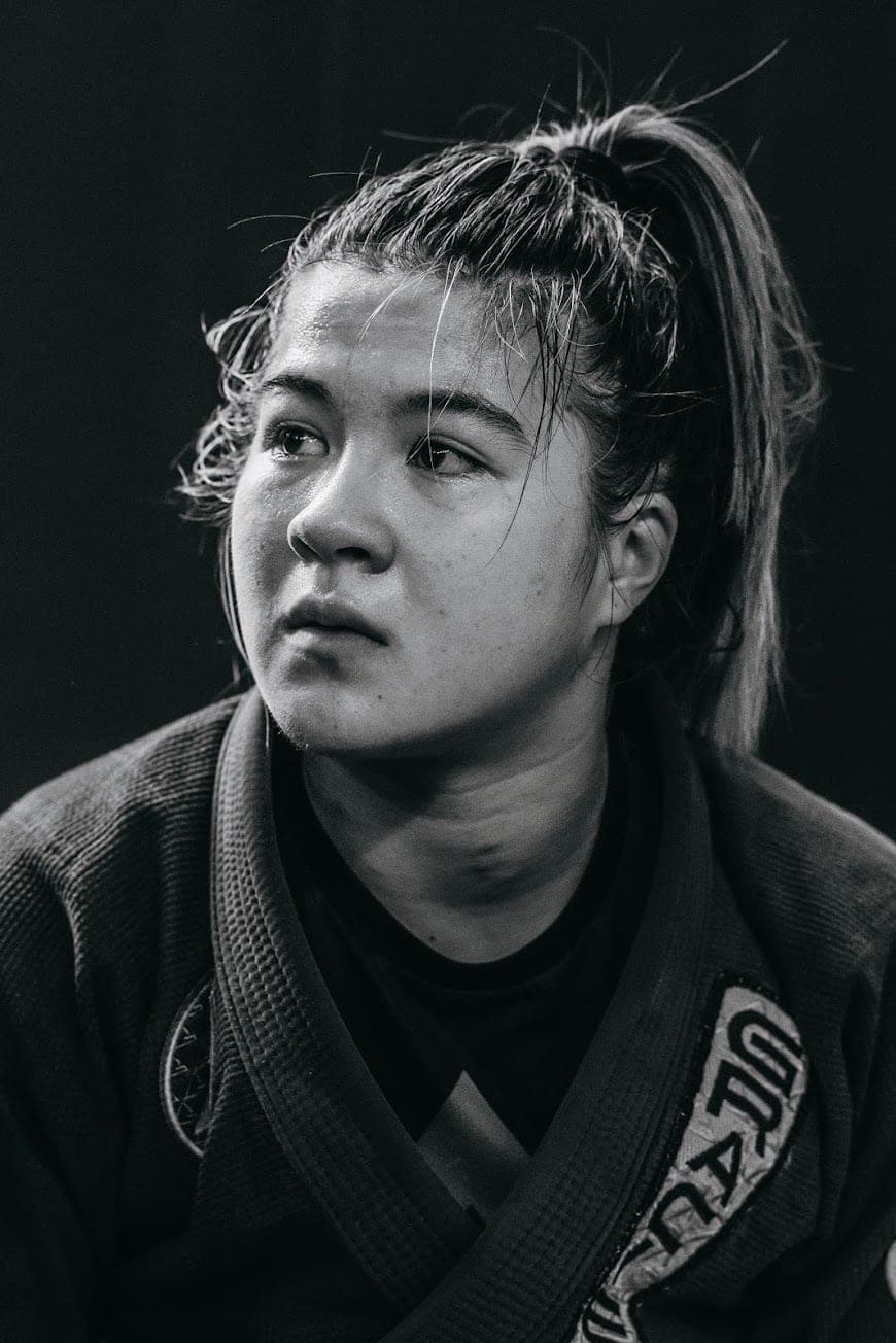 A grappler between rounds, looking away from the camera